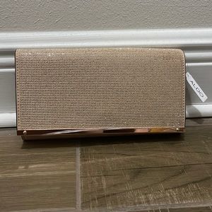 Rose gold ALDO clutch